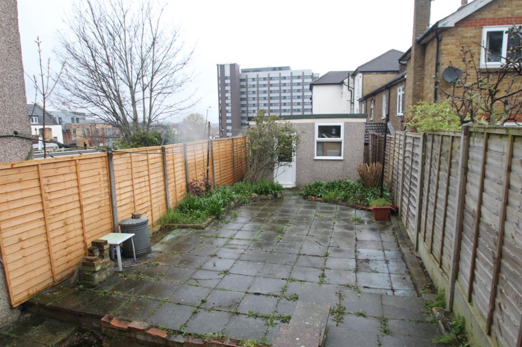 Lot: 163 - MID-TERRACE HOUSE FOR IMPROVEMENT - Paved garden area to rear of property